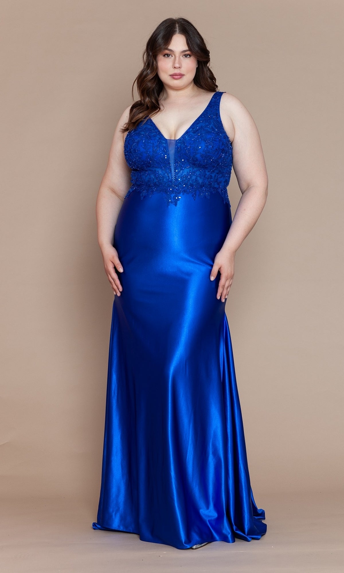 A woman poses against a plain beige background, wearing the Embroidered-Bodice Plus-Size Long Prom Dress W1160 in royal blue, featuring a sleeveless design, floor-length satin skirt, and fitted embroidered bodice.